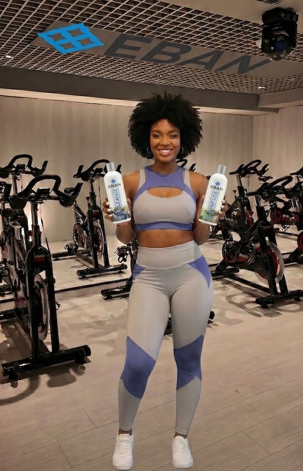 ebane-holding-two-EBAN-bottles Ebané in Spin class holding two EBAN bottles